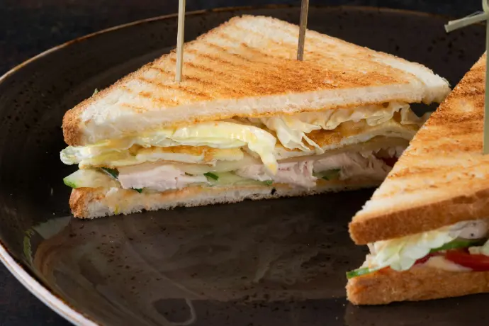 a sandwich cut in half on a plate